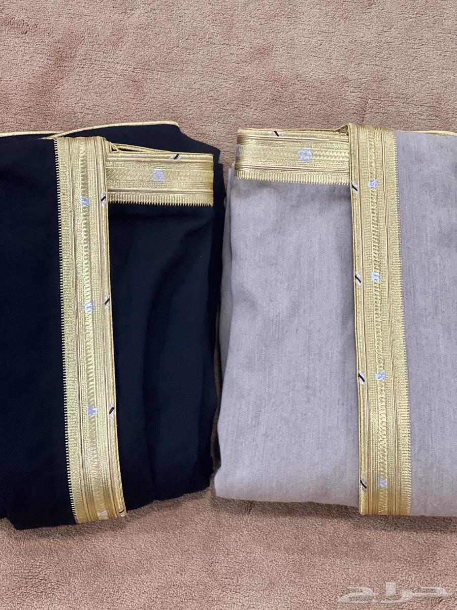 2 winter coats, black and beige, in like-new condition63324624350977112