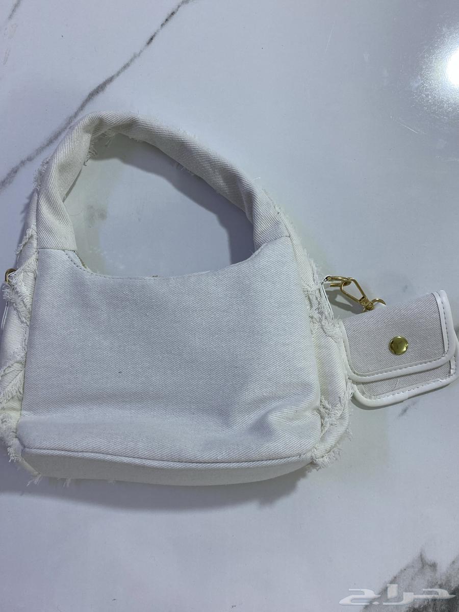 شنطه مع محفظة صغيرة جديده ما استعملت ابدا63319223977346111