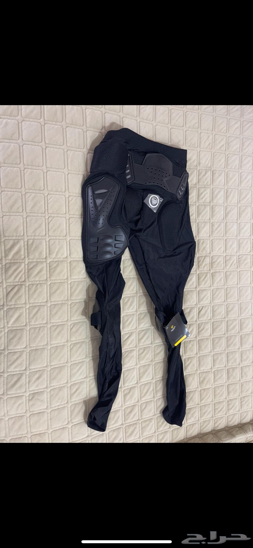 For sale, worn motorcycle safety gear and a real motorcycle helmet632712134141461123