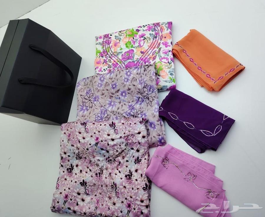 Three pieces of batik fabric with embroidered patterns and a cardboard box63617268840834111