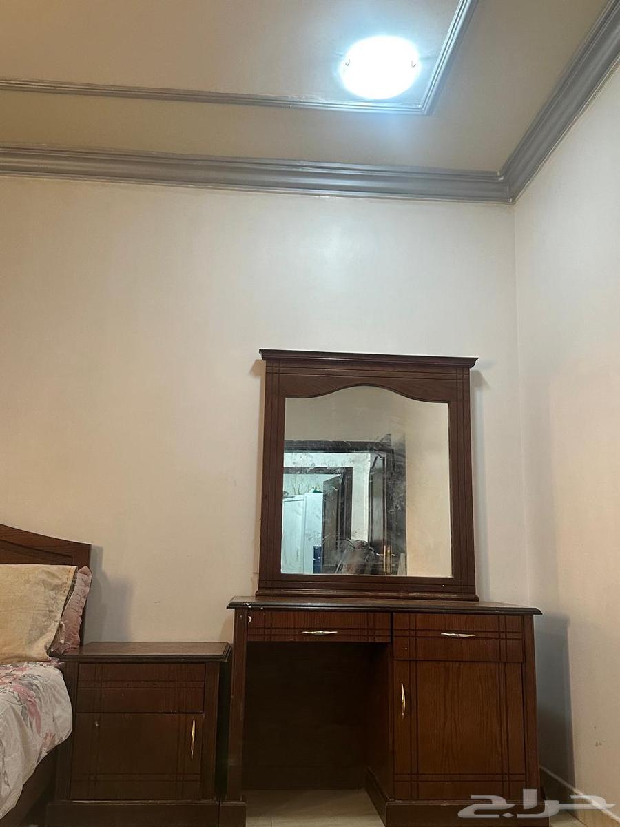 Bedroom with bed, dressing table, and 2 nightstands63532704596610111