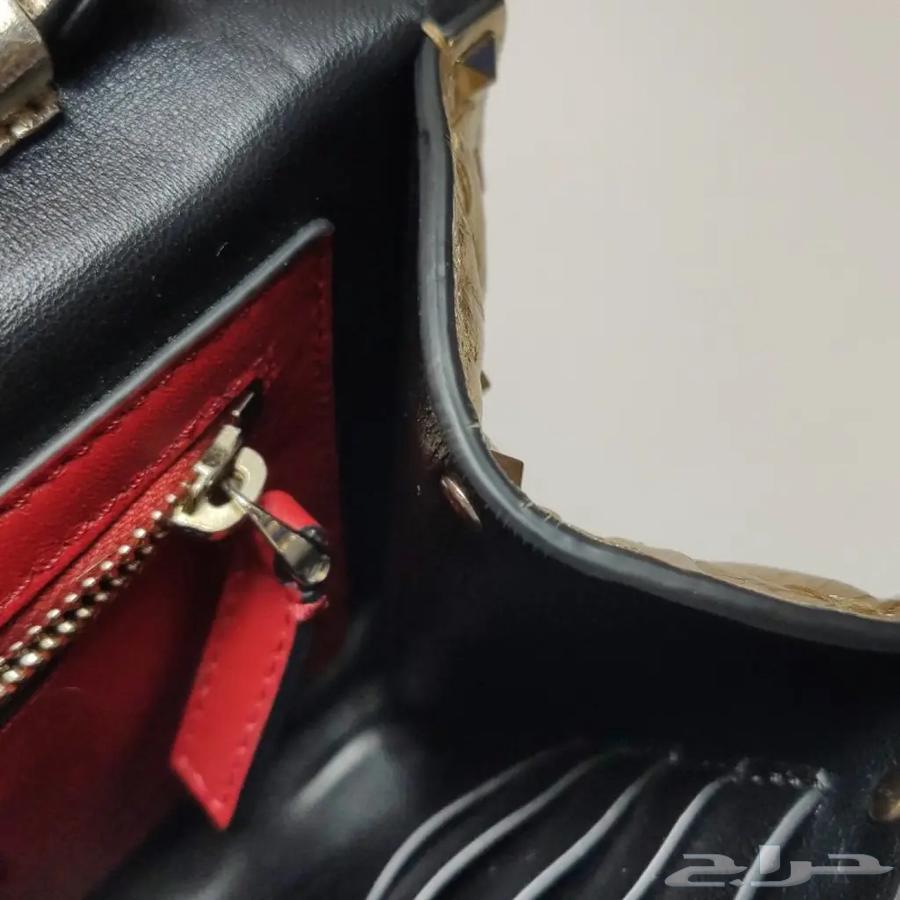 Valentino Garavani Spike clutch bag made of shiny nappa leather63210050762497111