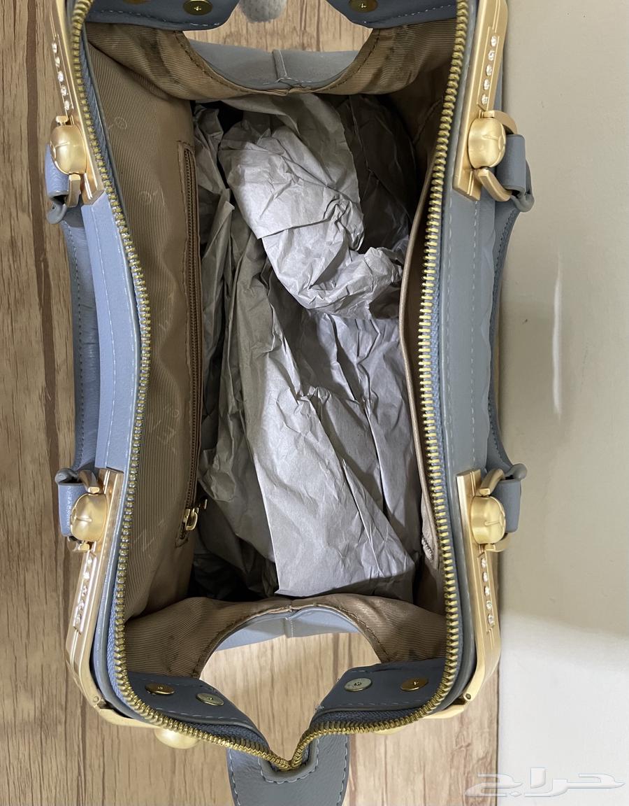 A bag in sky blue color.. selling allowed 8063213141671681112