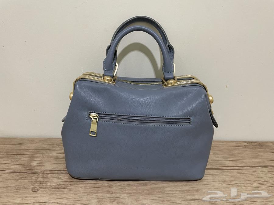 A bag in sky blue color.. selling allowed 8063213141671681113