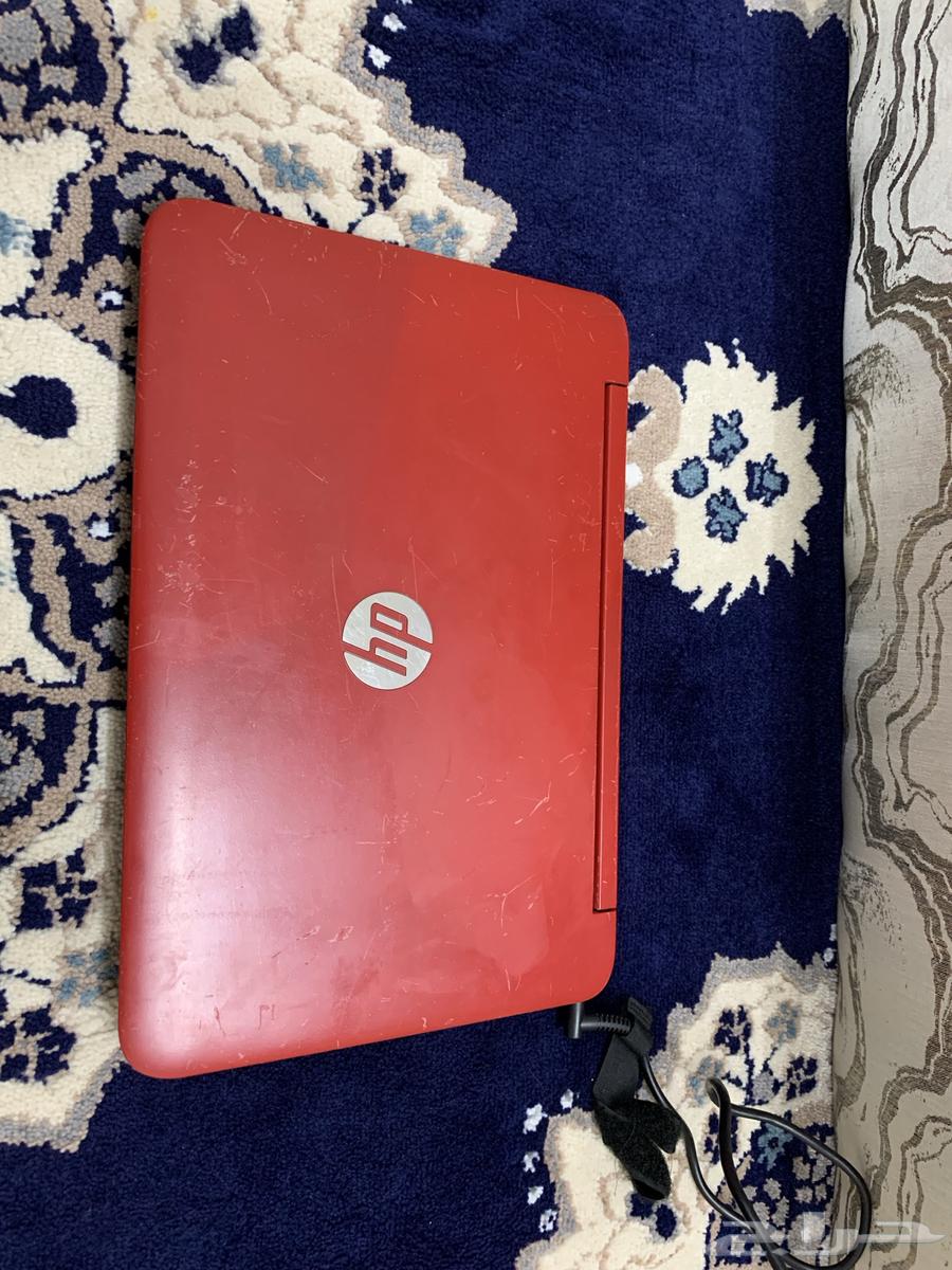 A working laptop computer with a massage device bag.63205077470083113