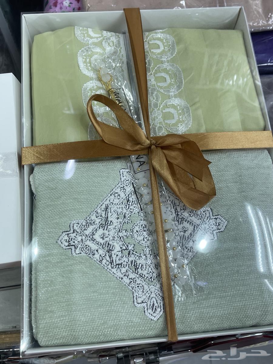 Prayer robe set, incense burners, Qur'ans, and a book with name inscription63205590538242111