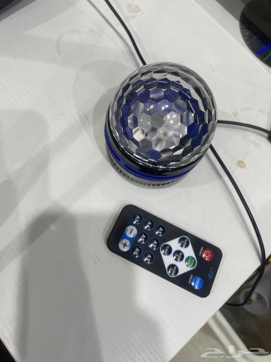 A display of a headset, a handheld microphone, a bright light, and a keyboard, but the items are used.63176370542979114