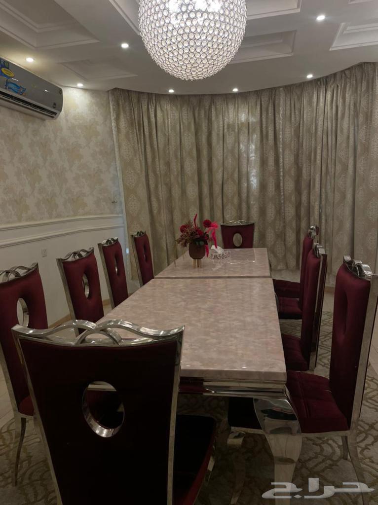 Two marble dining tables and 12 maroon velvet chairs for 1000 riyals631754796380181116