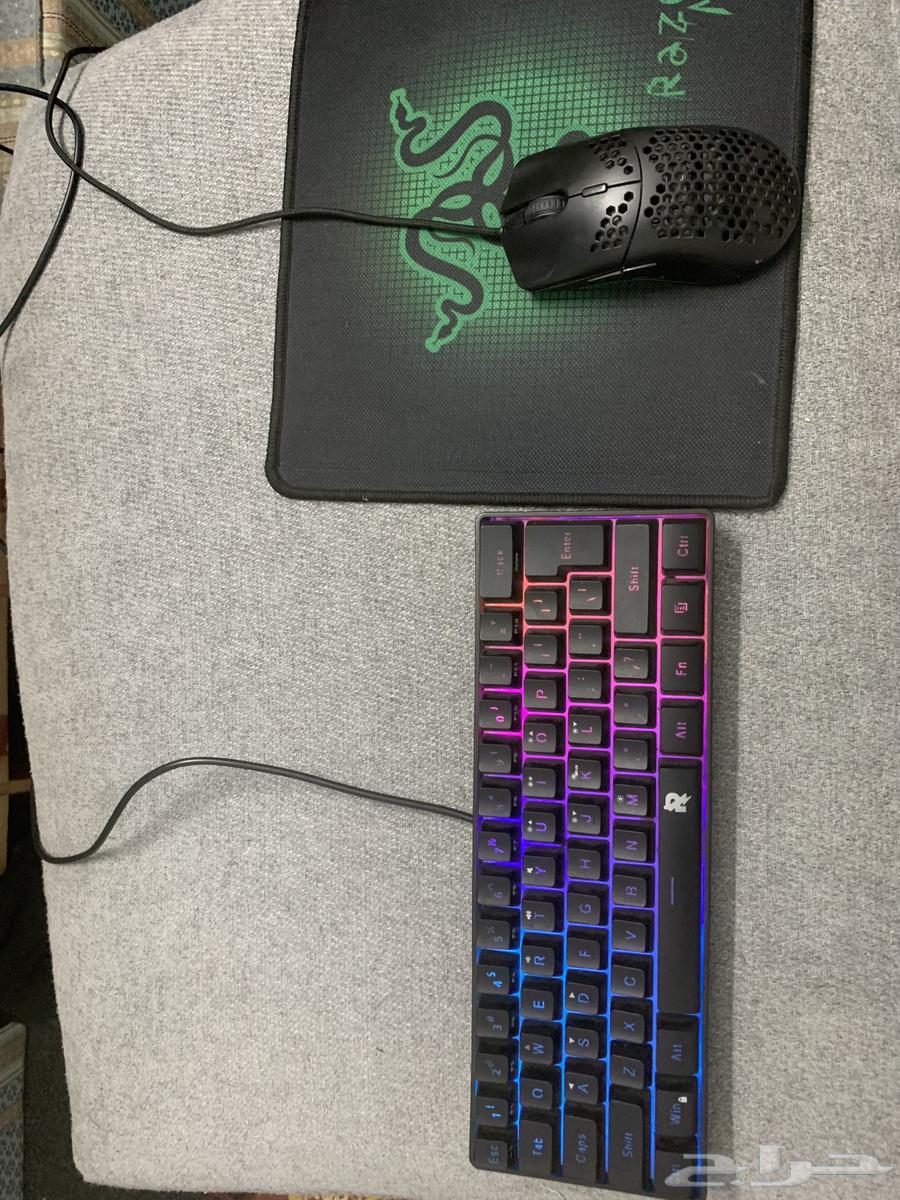 Sony 5 regular user with mouse, keyboard, and God of War 3 game disc.63173251889921112