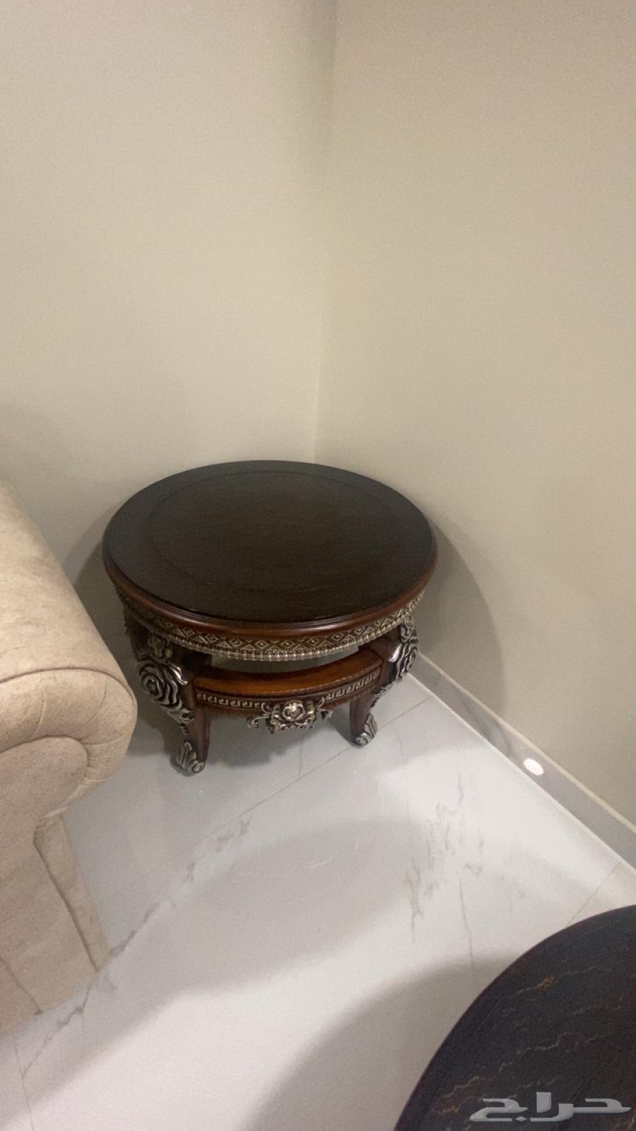 A table with a set of two small tables63526834459267114