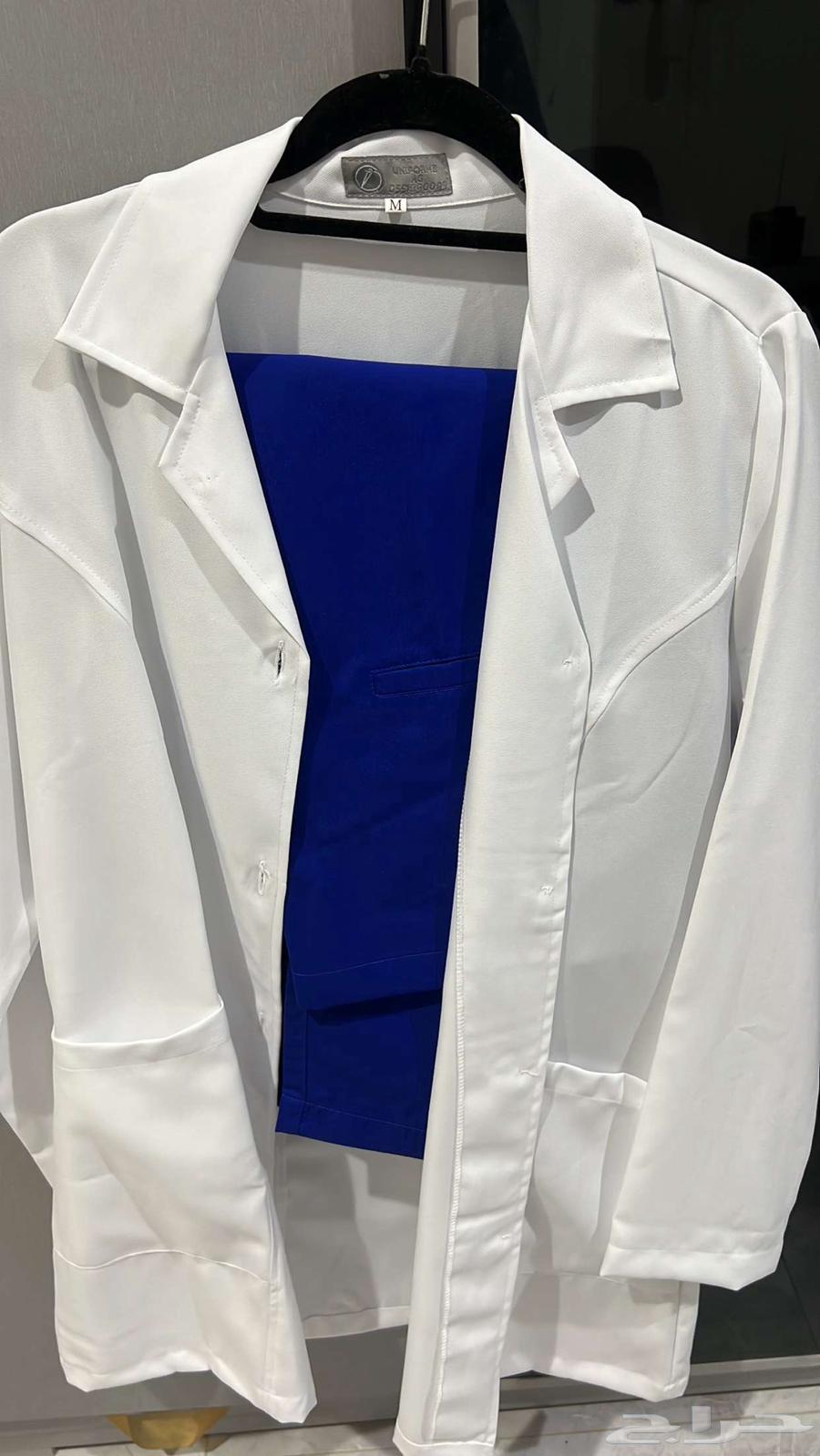 Lab coat and blue medical scrubs63097498781314111