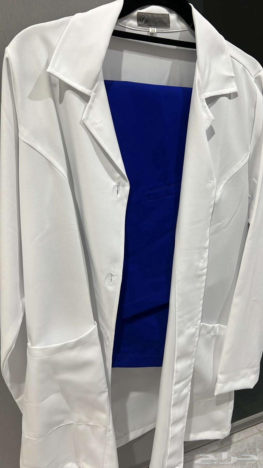 Lab coat and blue medical scrubs63097498781314111