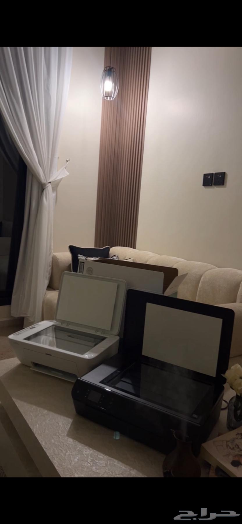 Two HP printers: one black used, and one white new one bought two days ago63083464554499117