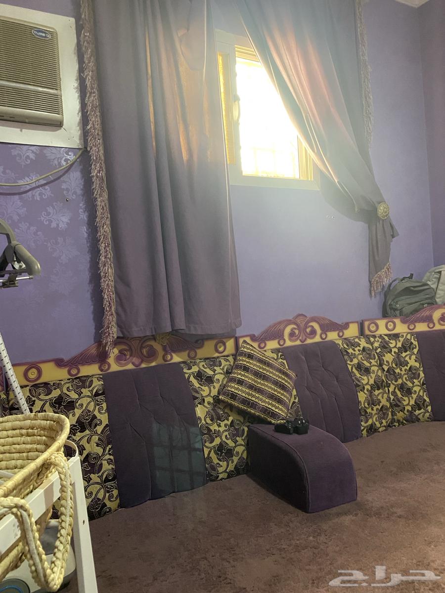 It is a ladies' parlor with a floor sofa, its own curtains and an iron.63069659111169111