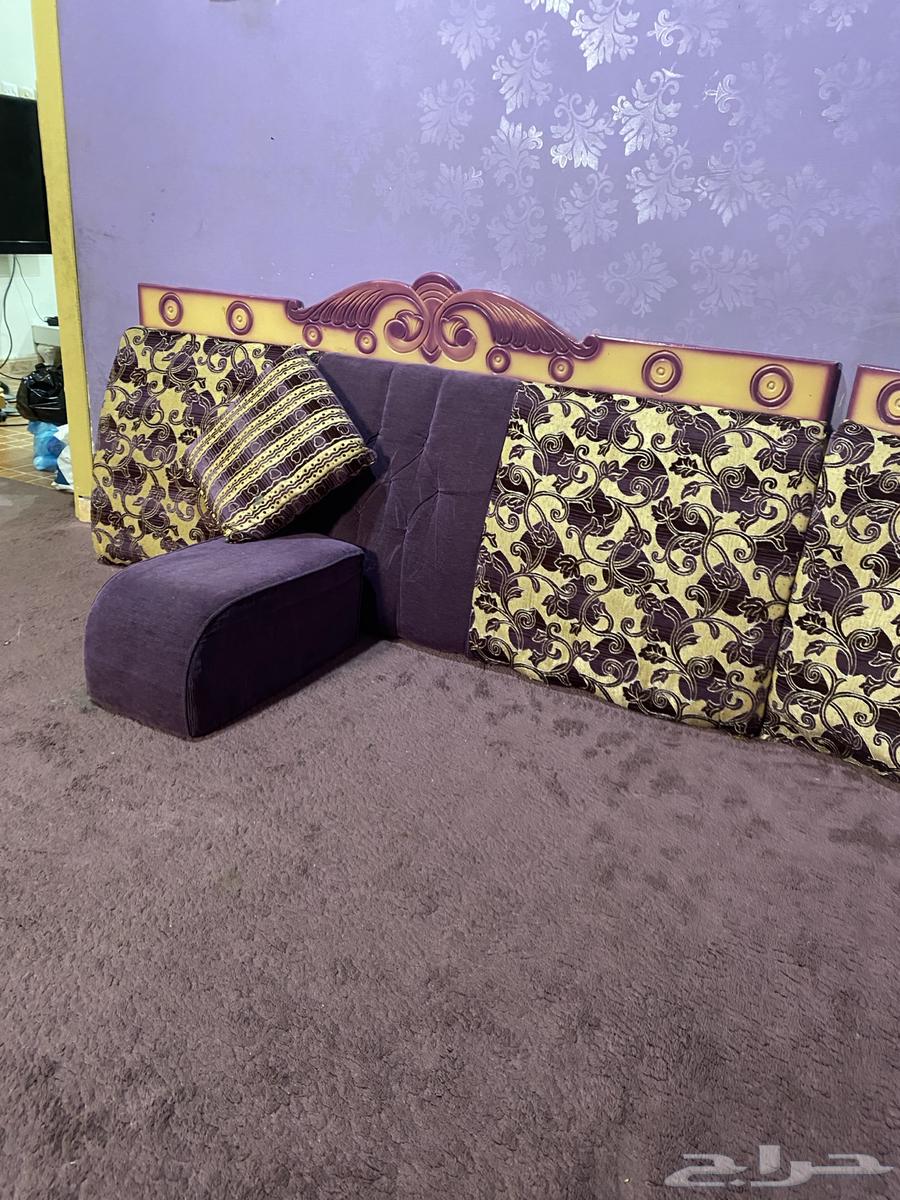 It is a ladies' parlor with a floor sofa, its own curtains and an iron.63069659111169114