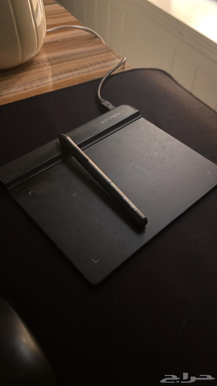 A Wacom device used connects to a laptop and personal computer with a pen630540567700491116