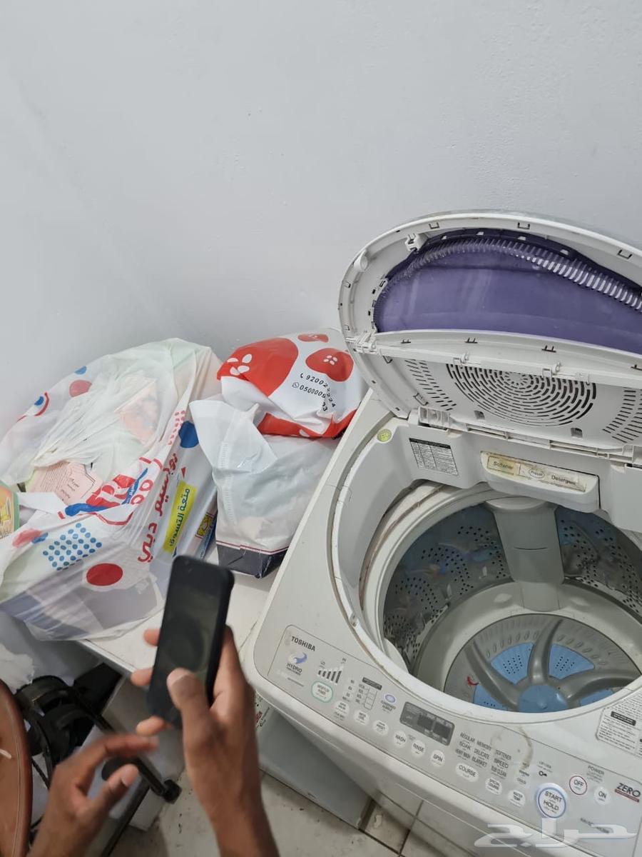 Two washers and a clean dryer, and a clean living room63419677573121112