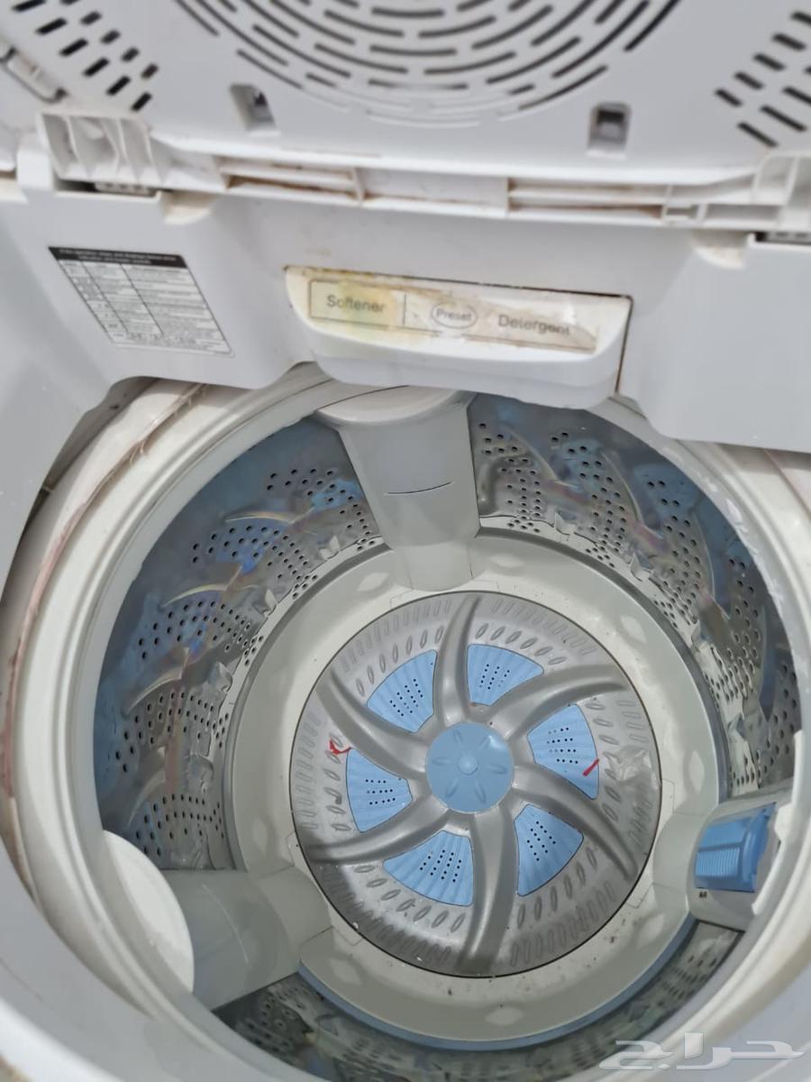 Two washers and a clean dryer, and a clean living room634196775731211111
