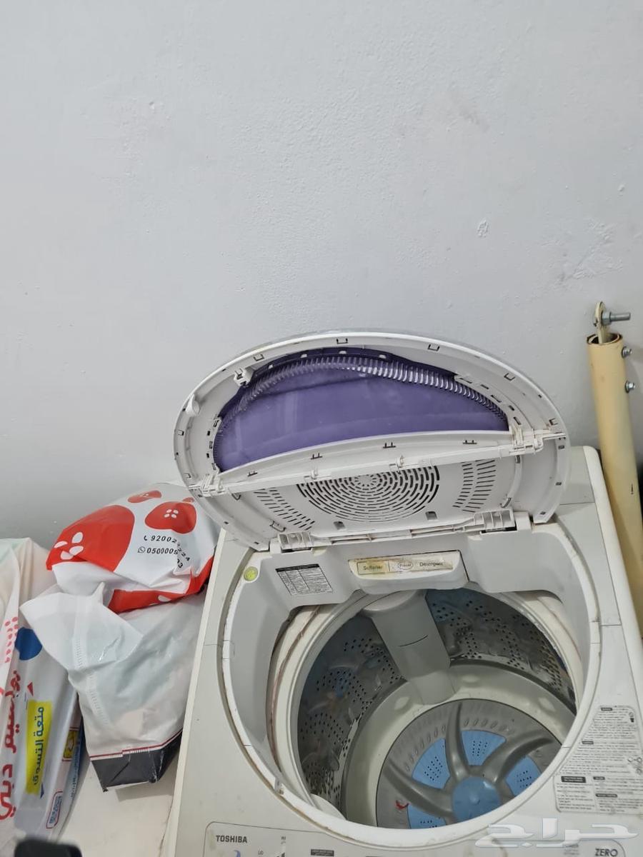 Two washers and a clean dryer, and a clean living room63419677573121111