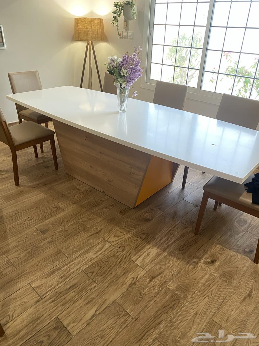 A large dining table with a buffet cabinet63376260857859111