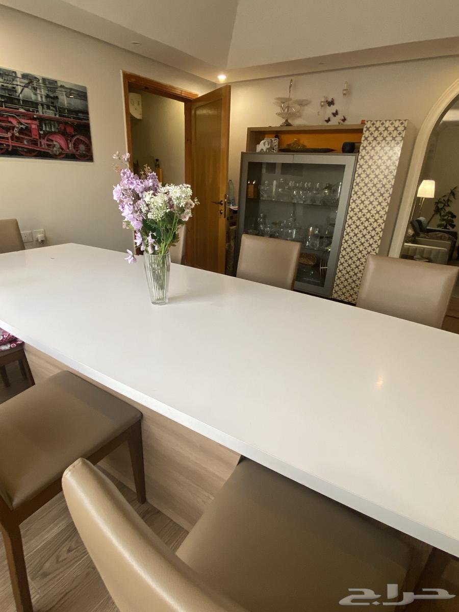 A large dining table with a buffet cabinet63376260857859112