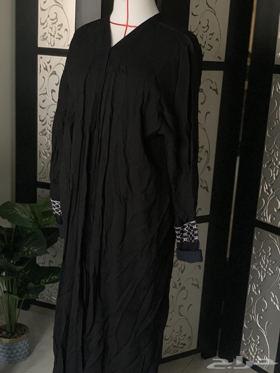 A used black and navy abaya63398405861763111