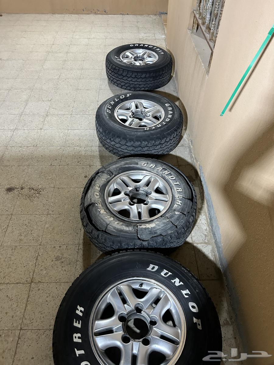 4 original Lexus rims with caps and 3 Dunlop tires63699591014659111
