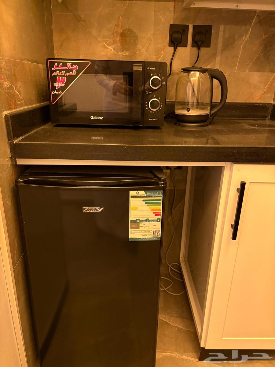 Microwave, kettle, and new refrigerator63667554098947110