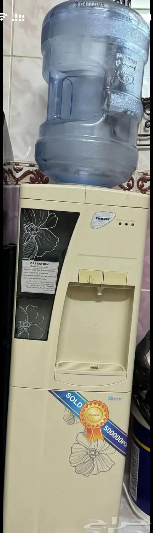 Sofa for sale, water cooler, and baby stroller63674275950337110