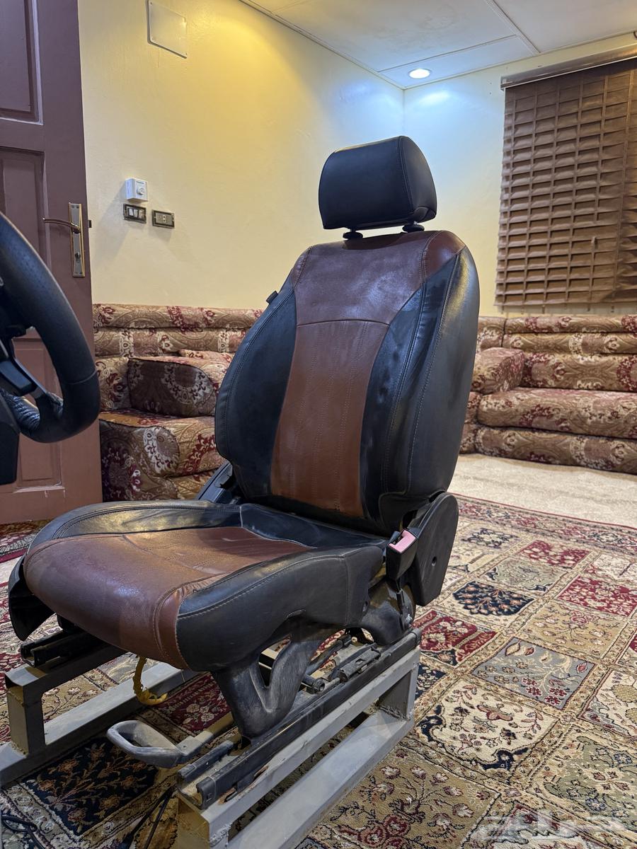 Xbox with steering wheel, sports car seat, and Forza game63699621965571114