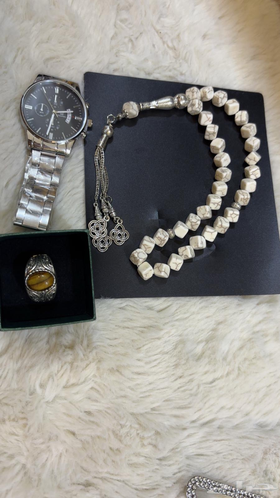 Two watches, a rosary, and a ring63699633037954110