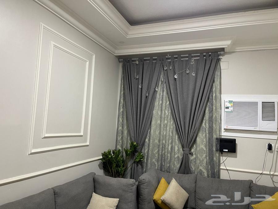 Sofa, table, and curtains63705944316931112
