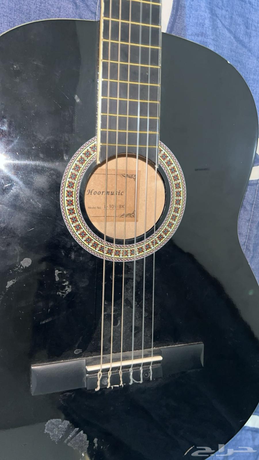 A new guitar with no flaws and all strings present63734049479297113