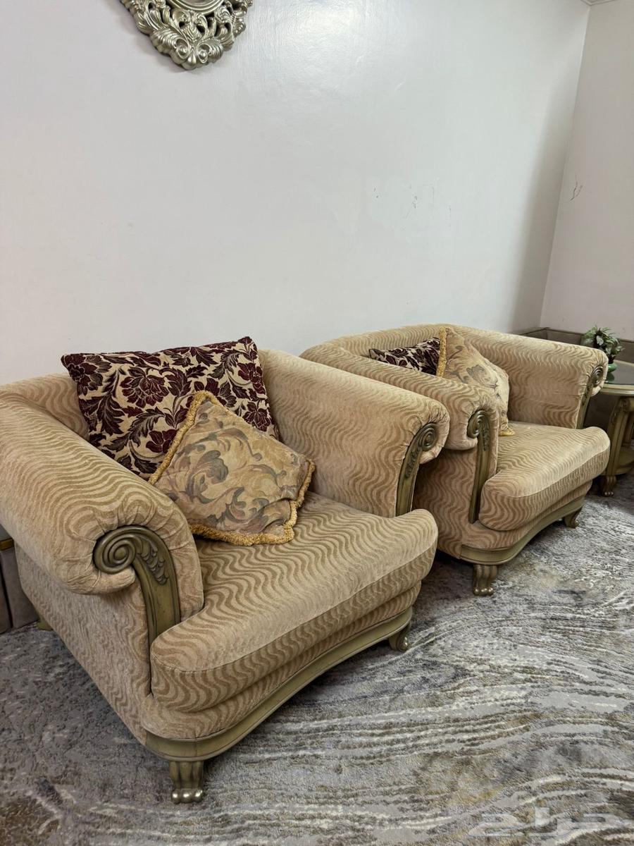 Beige sofa with tables and curtain63655709503490112