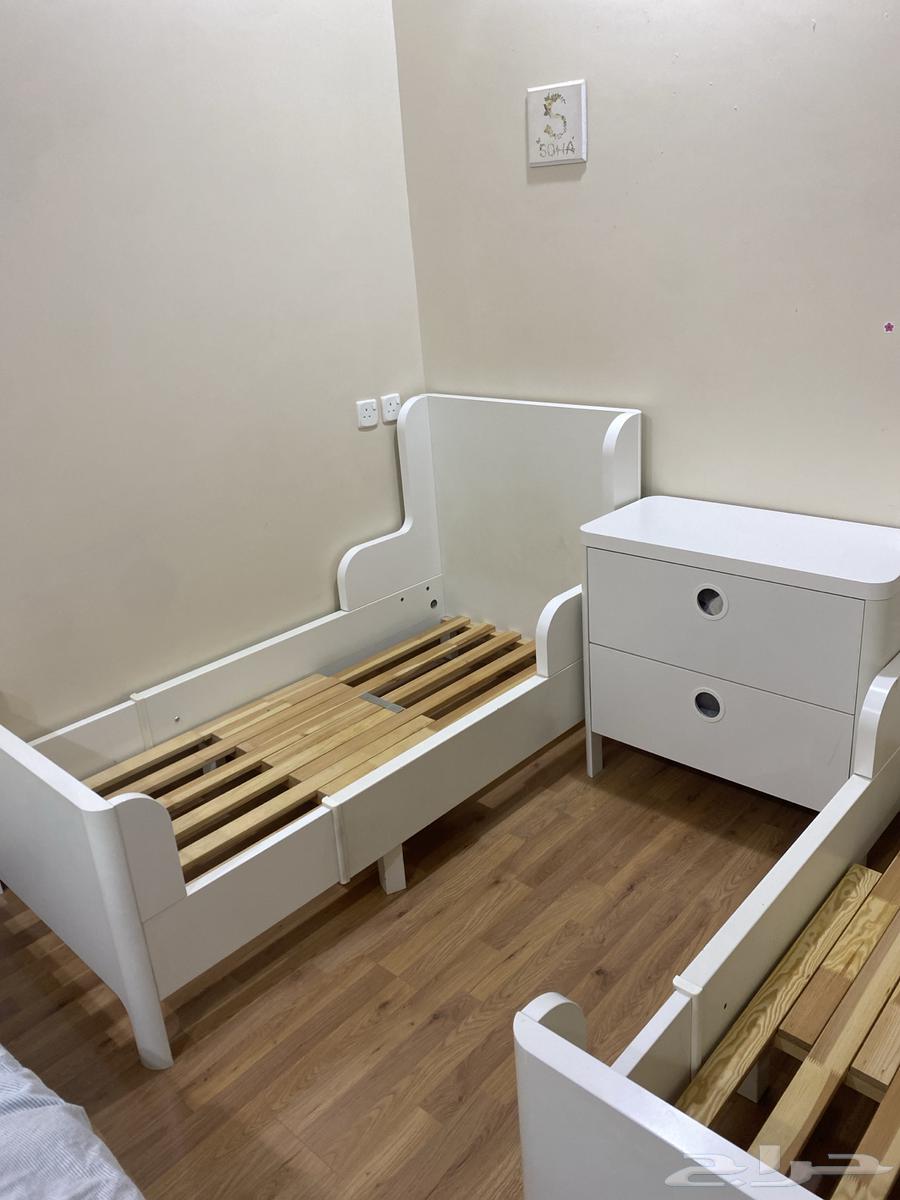 Two beds and the table between them from IKEA63738854679041113