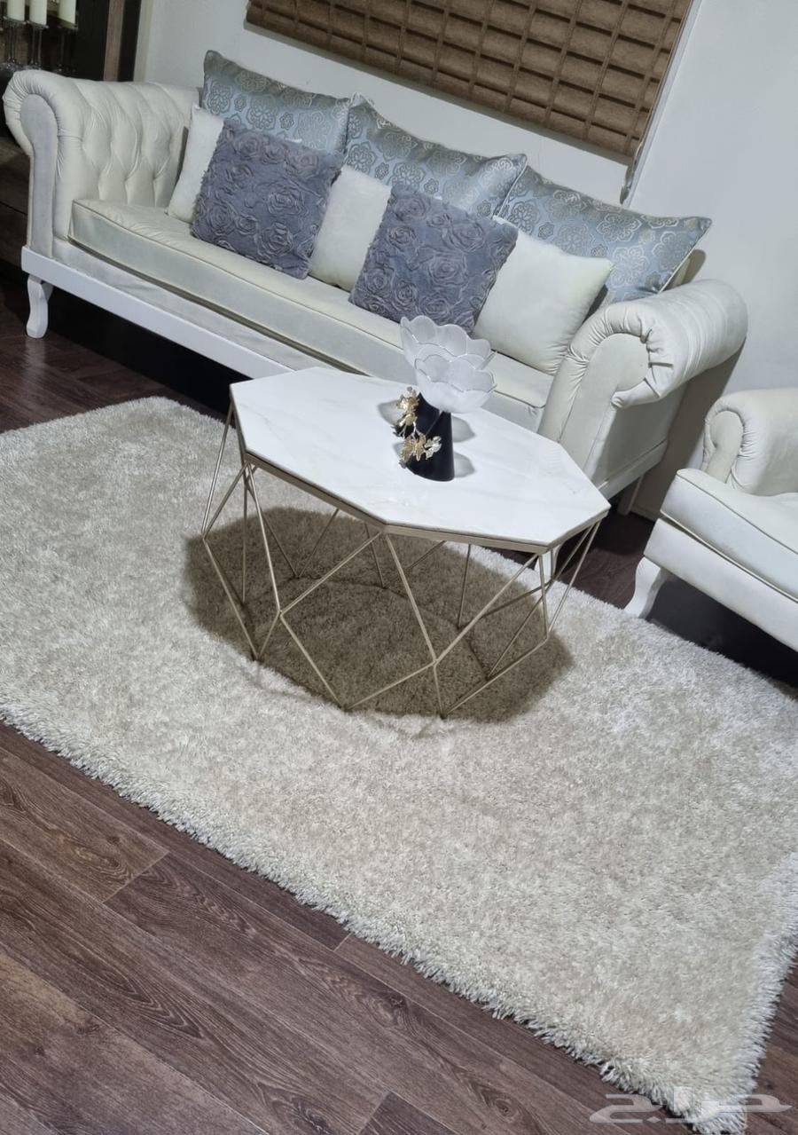 Three-person sofa with a single chair, hexagonal table, and carpet63743675993347111