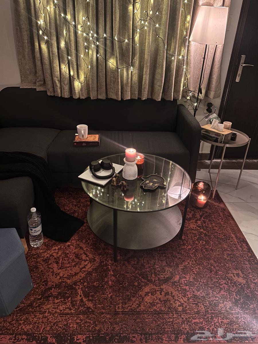 L-shaped sofa with a round table and cushion, all from IKEA63745916089986111