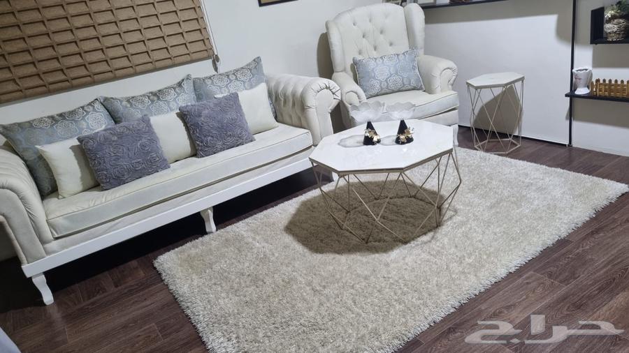 Three-person sofa with a single chair, hexagonal table, and carpet63743675993347112
