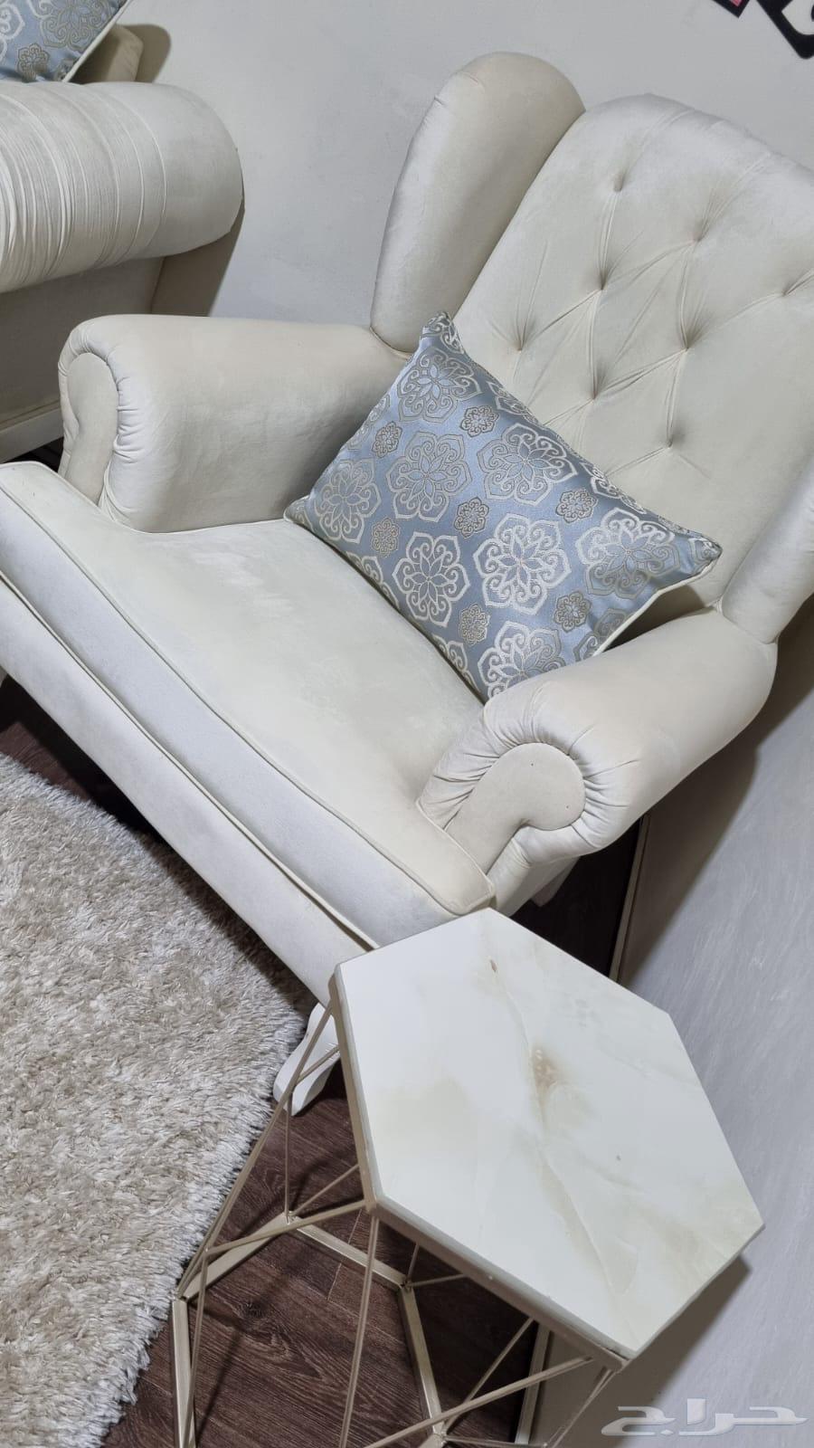 Three-person sofa with a single chair, hexagonal table, and carpet63743675993347114