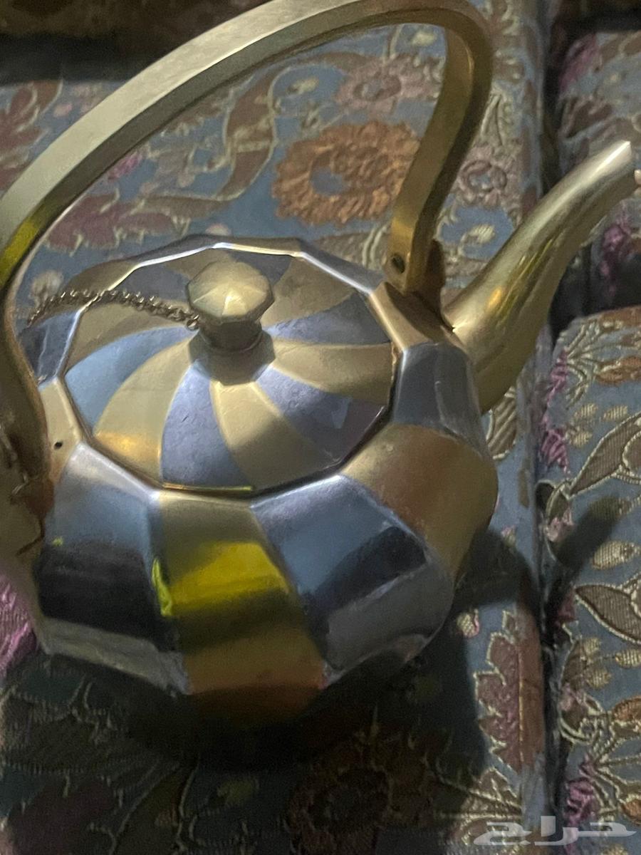 Dallah and sword pitcher. And three pitcher set. And handleless jug63763564339715114