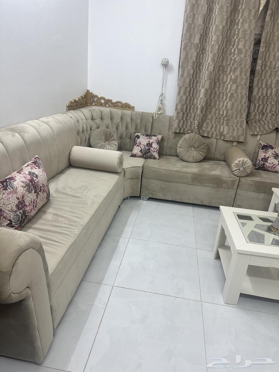 Beige sofa with curtain and tables63772425176835111