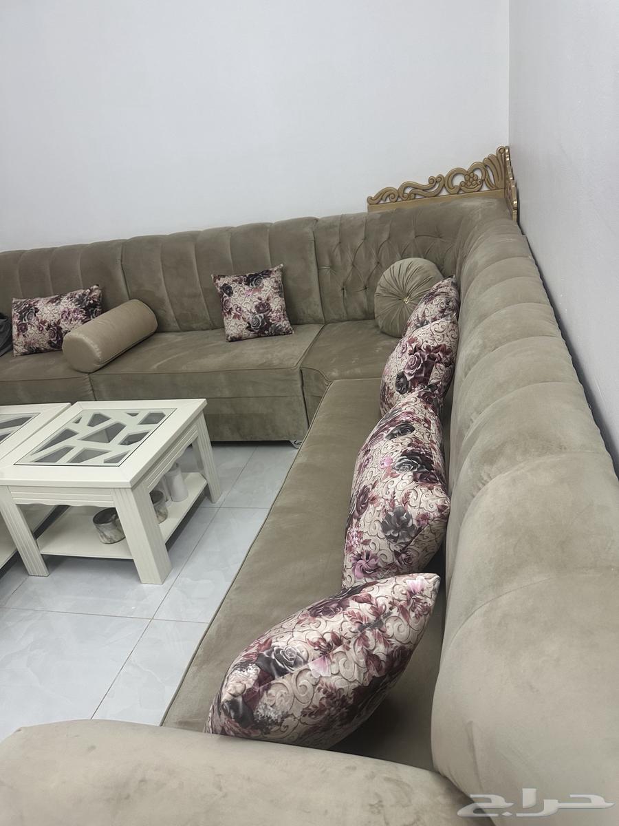 Beige sofa with curtain and tables63772425176835112