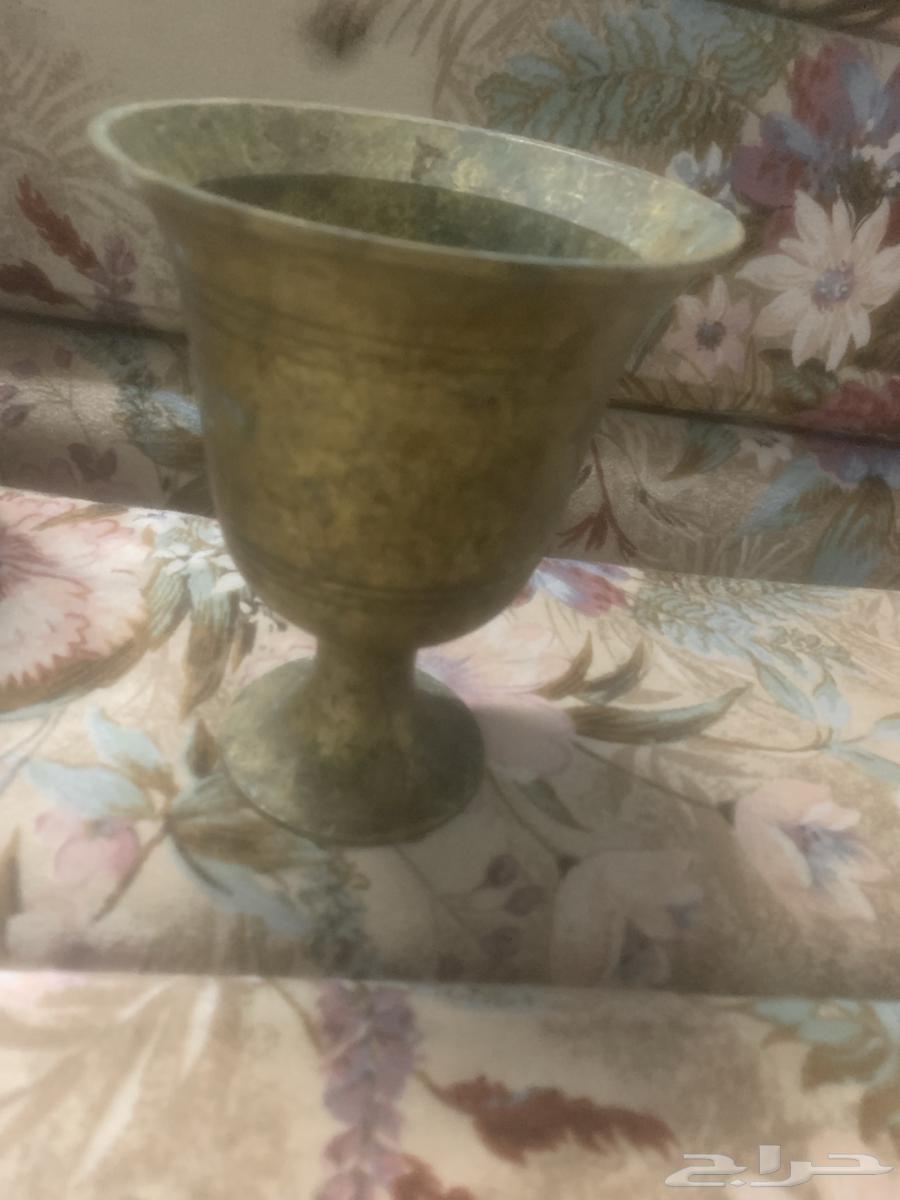 Dallah and sword pitcher. And three pitcher set. And handleless jug63763564339715111