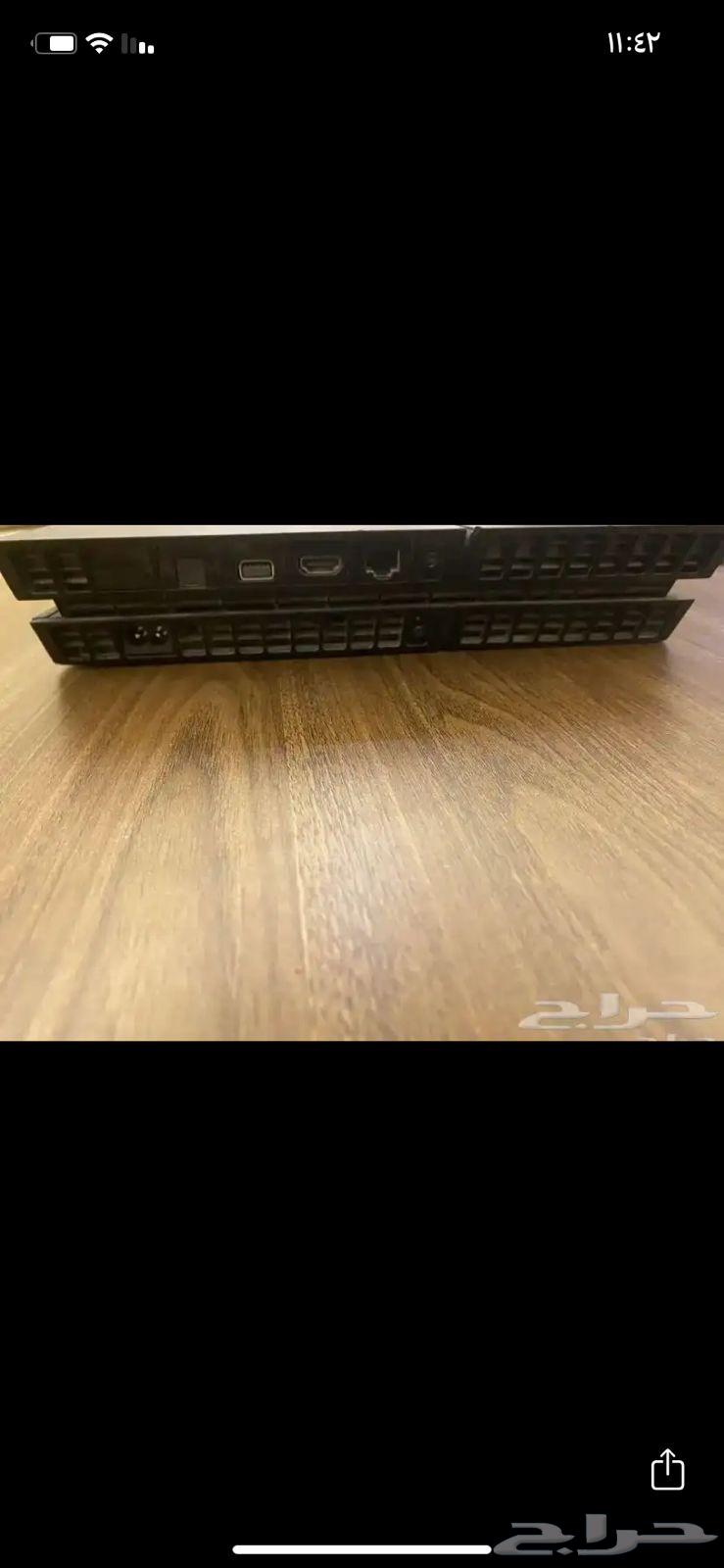 Sony 4 with its cables, mouse, and keyboard with two hands63773905796739112