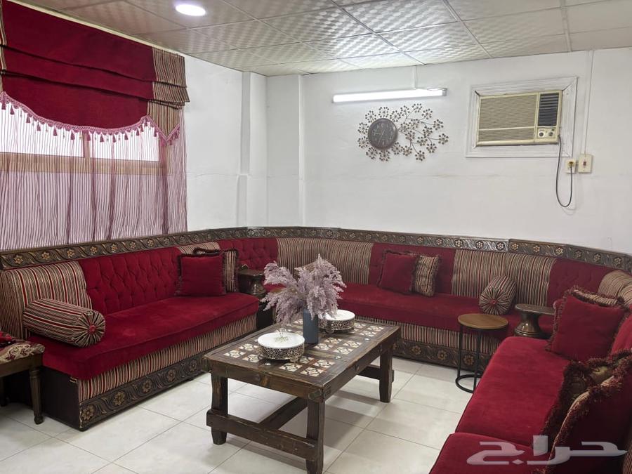 Red sofa with tables, curtain, and clock - no damages and in good condition63787165251842110