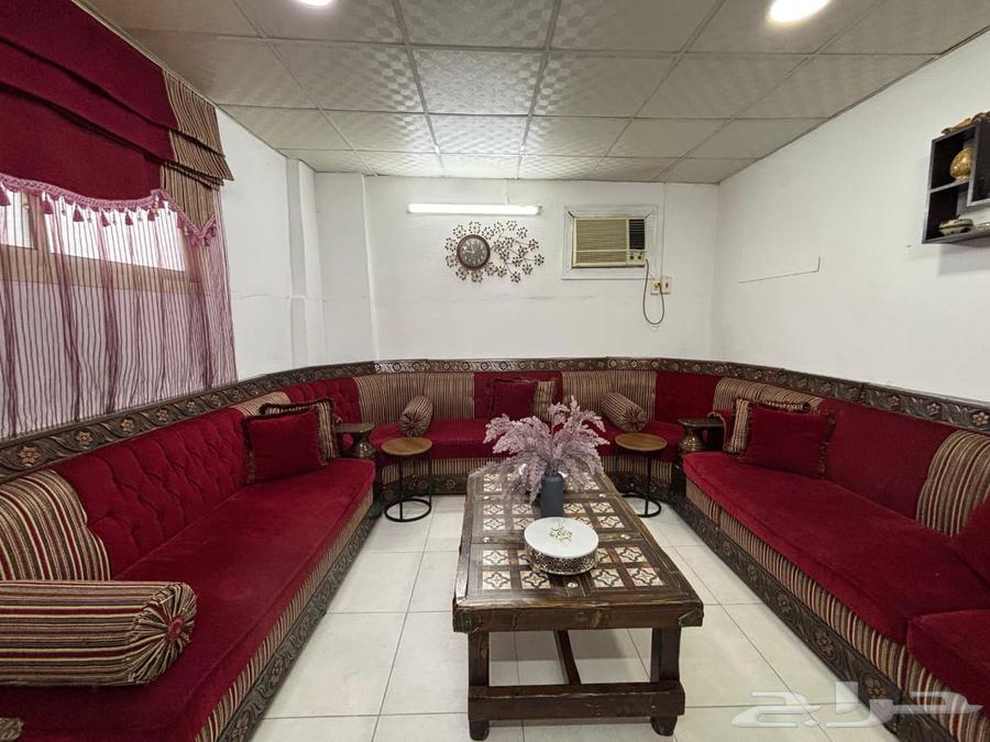 Red sofa with tables, curtain, and clock - no damages and in good condition63787165251842111