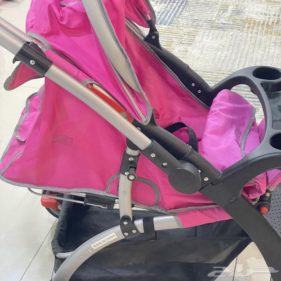 Two pink baby strollers with car seat64120416817025111