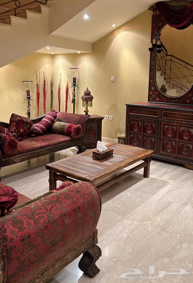 Two heavy Indian antique sofas with a cabinet-shaped console64141551085953111