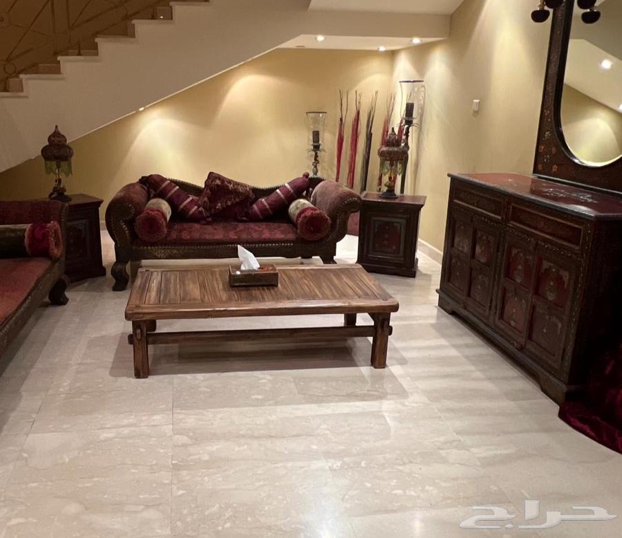 Two heavy Indian antique sofas with a cabinet-shaped console64141551085953110