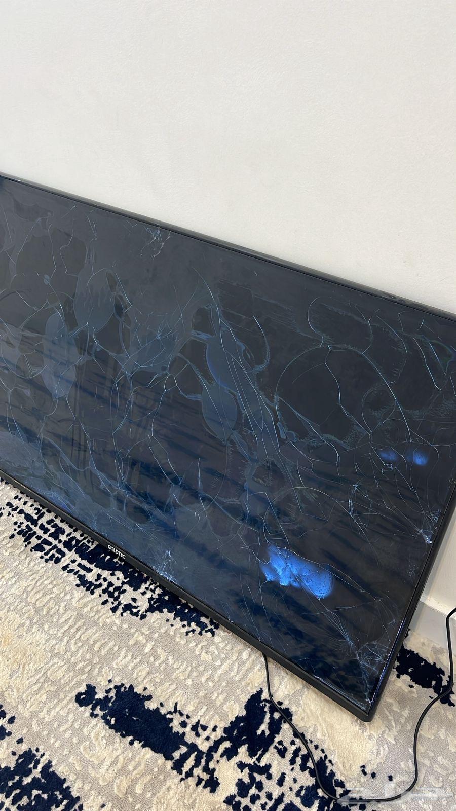 Refrigerator, broken TV screen, and microwave64141918874370111